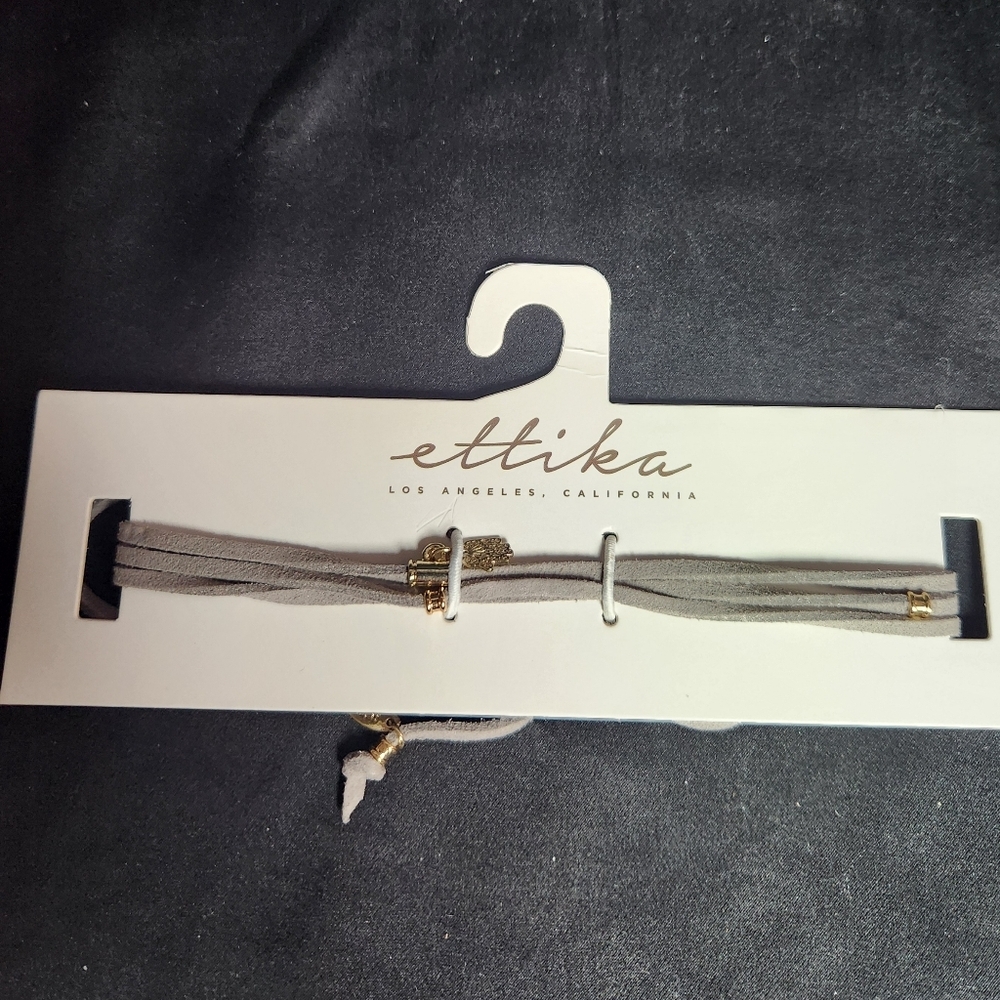 Ettika grey suede bracelet with hand pendant
